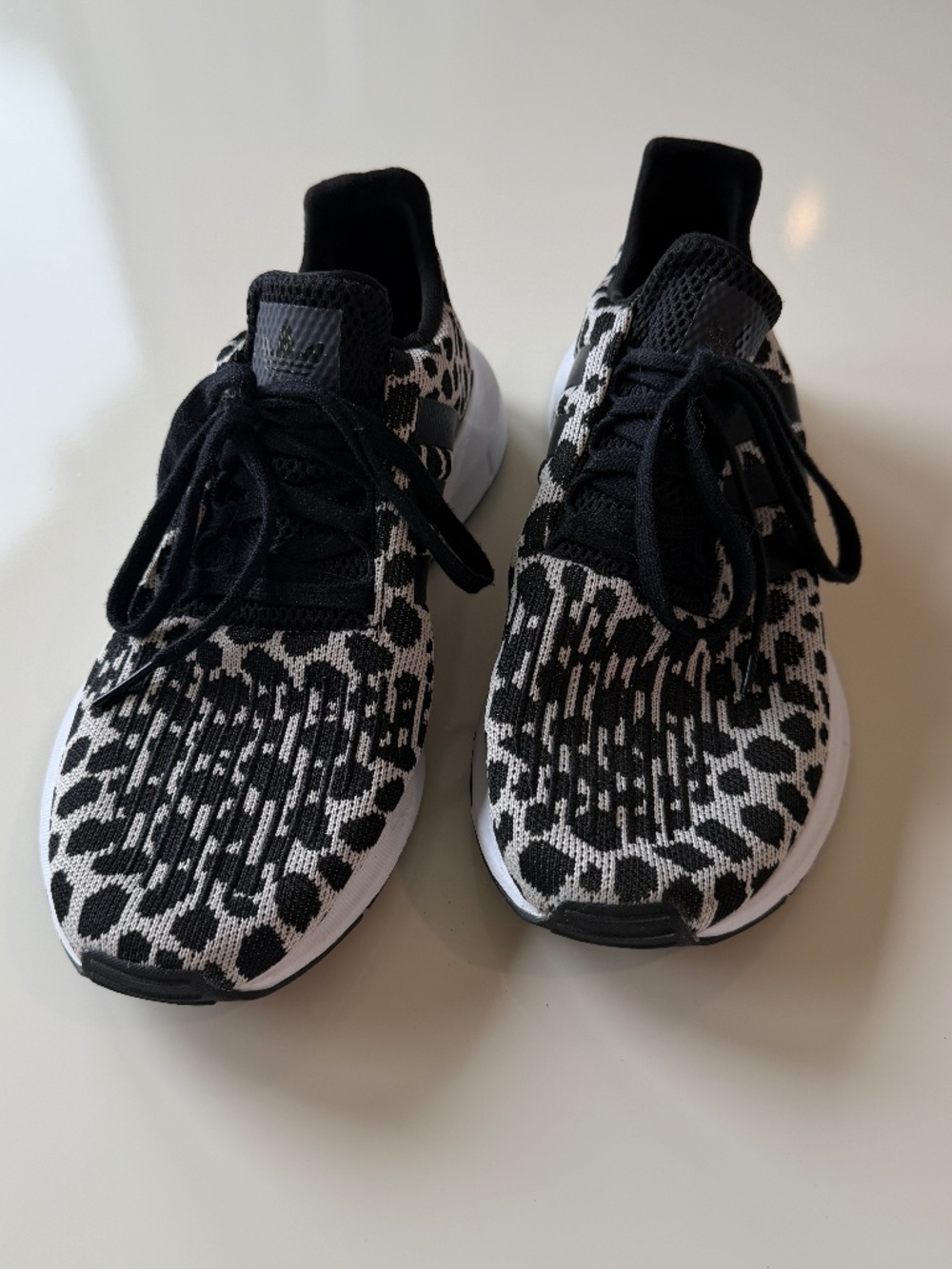 Adidas Swift Run 1.0 shoes, black/cream leopard design, women's size 8.5
